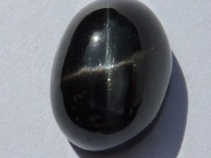 Russian black cabochon diopside starred with four branches "black star"