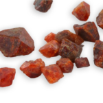 кристаллы дурангита из Мексики
