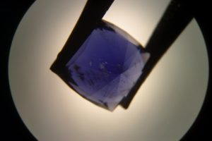 solid inclusions in cordierite showing its dark color