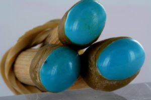 cabochons of turquoise from Nishapur in Iran on little sticks