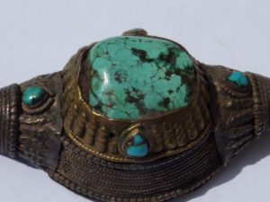 turquoise on ancient Tibetan jewel